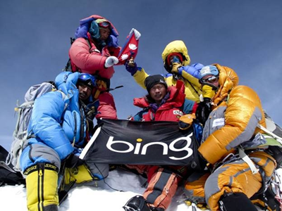 Eric Larsen and his team on top of Mt. Everest with the Bing Flag